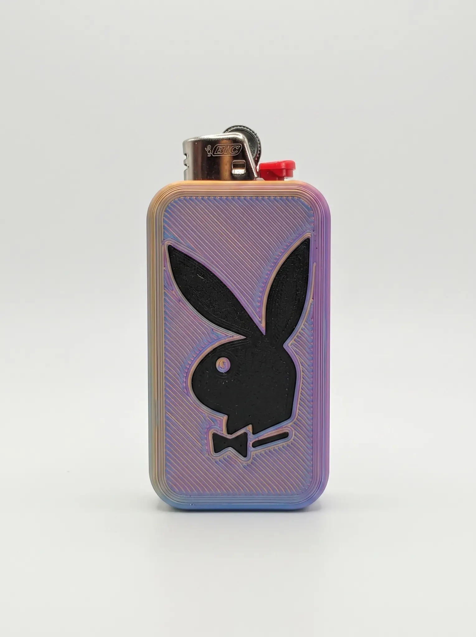 Iridescent pastel 3D-printed lighter sleeve with a raised black bunny-and-bow icon