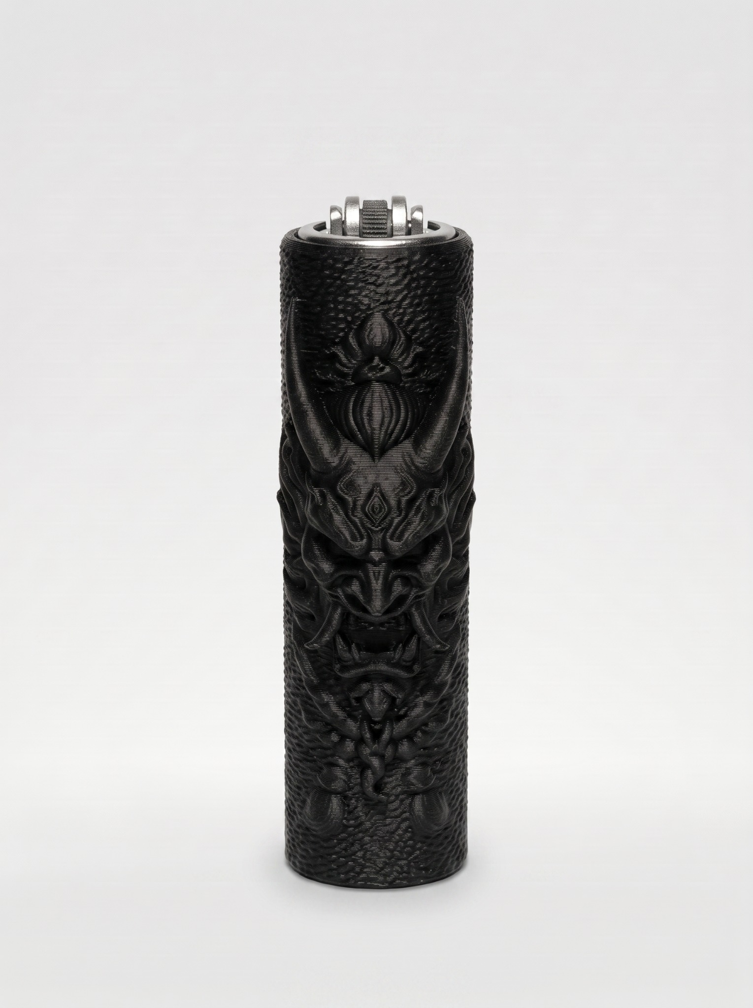 Matte-black Dragon Oni lighter sleeve with raised dragon and oni mask details