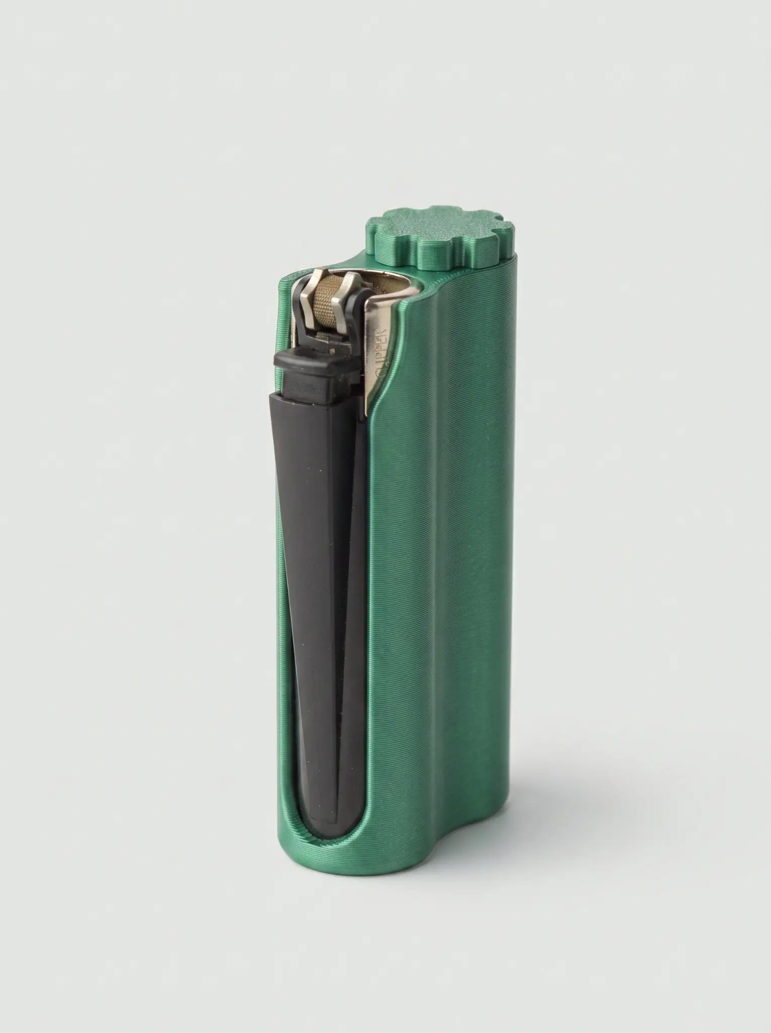 Emerald-green dual-compartment lighter sleeve with a black lighter and screw-top storage compartment