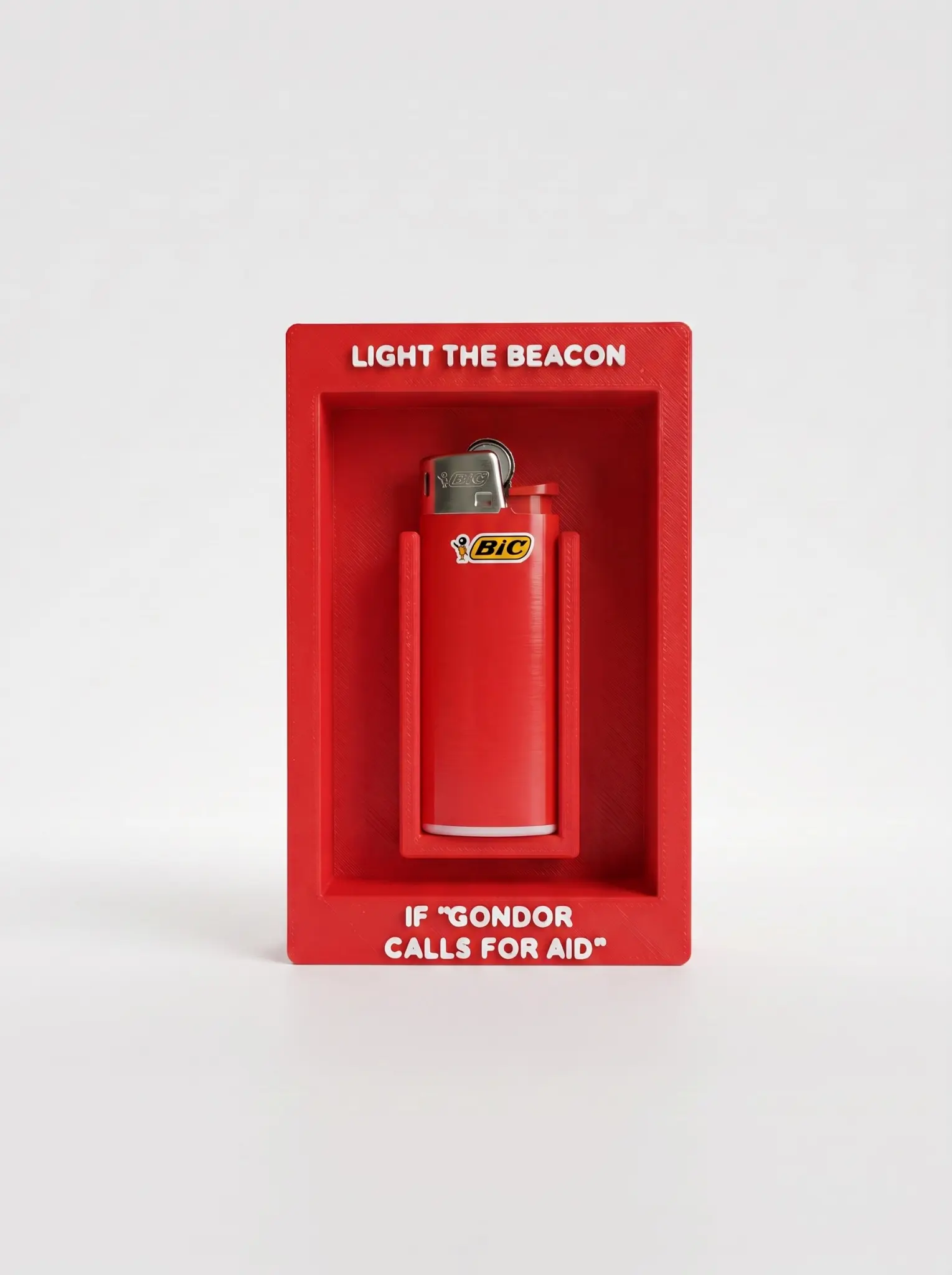 Signal-red emergency lighter display case with raised white lettering and a fitted lighter holder