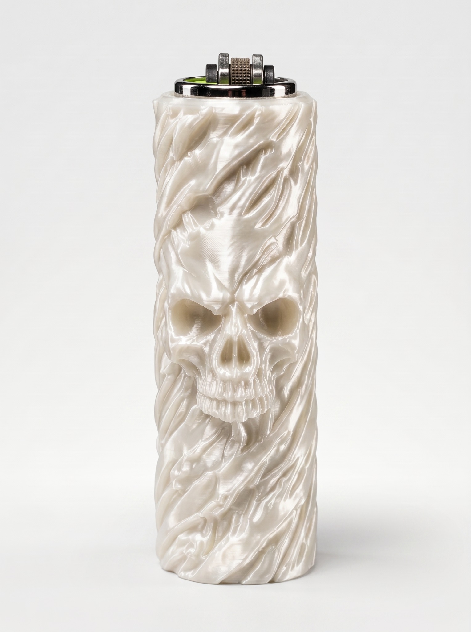 Pearl-white cylindrical lighter sleeve with an emerging skull sculpted into the surface