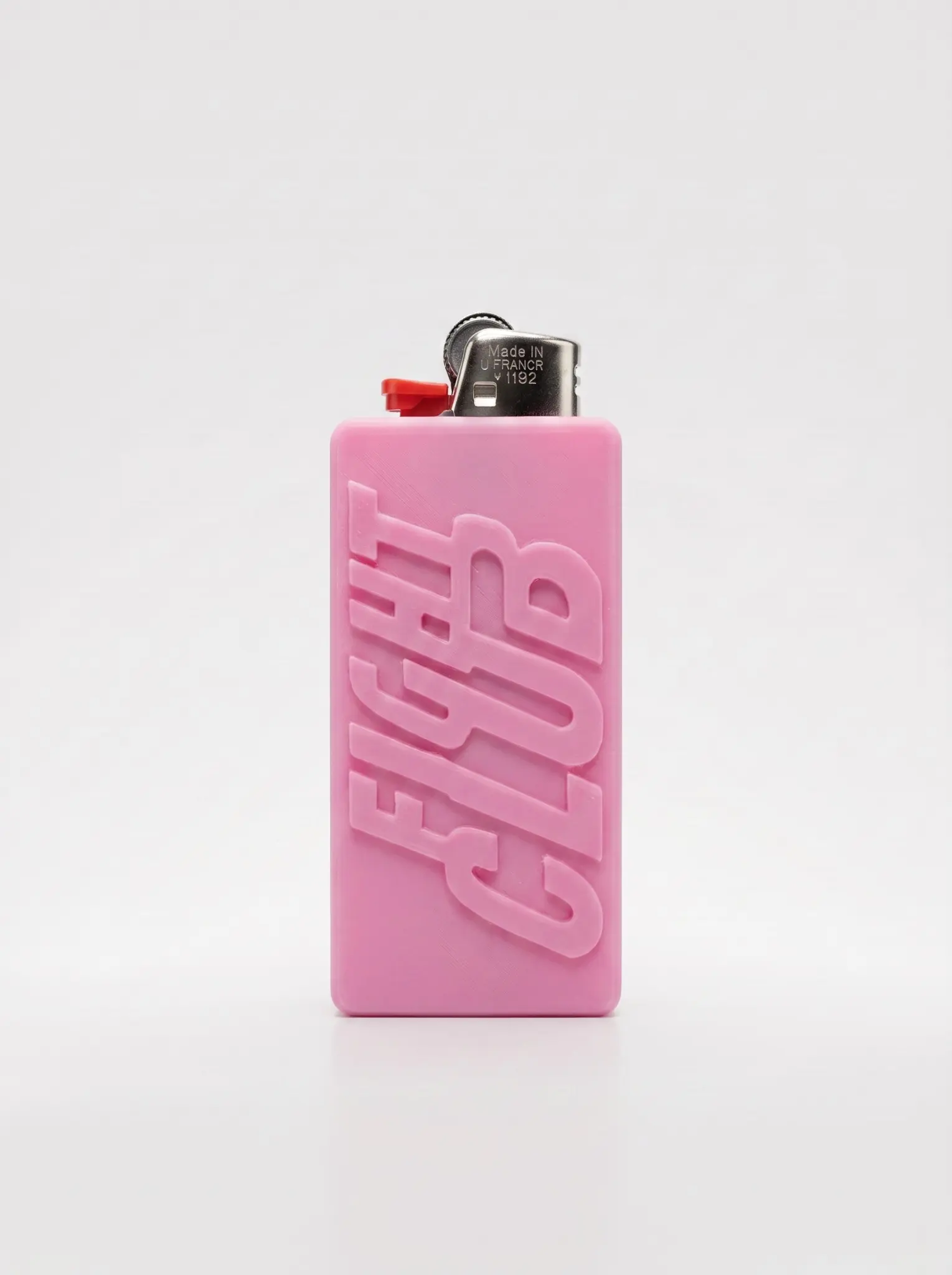 Pink soap-bar-style lighter sleeve with raised Fight Club lettering