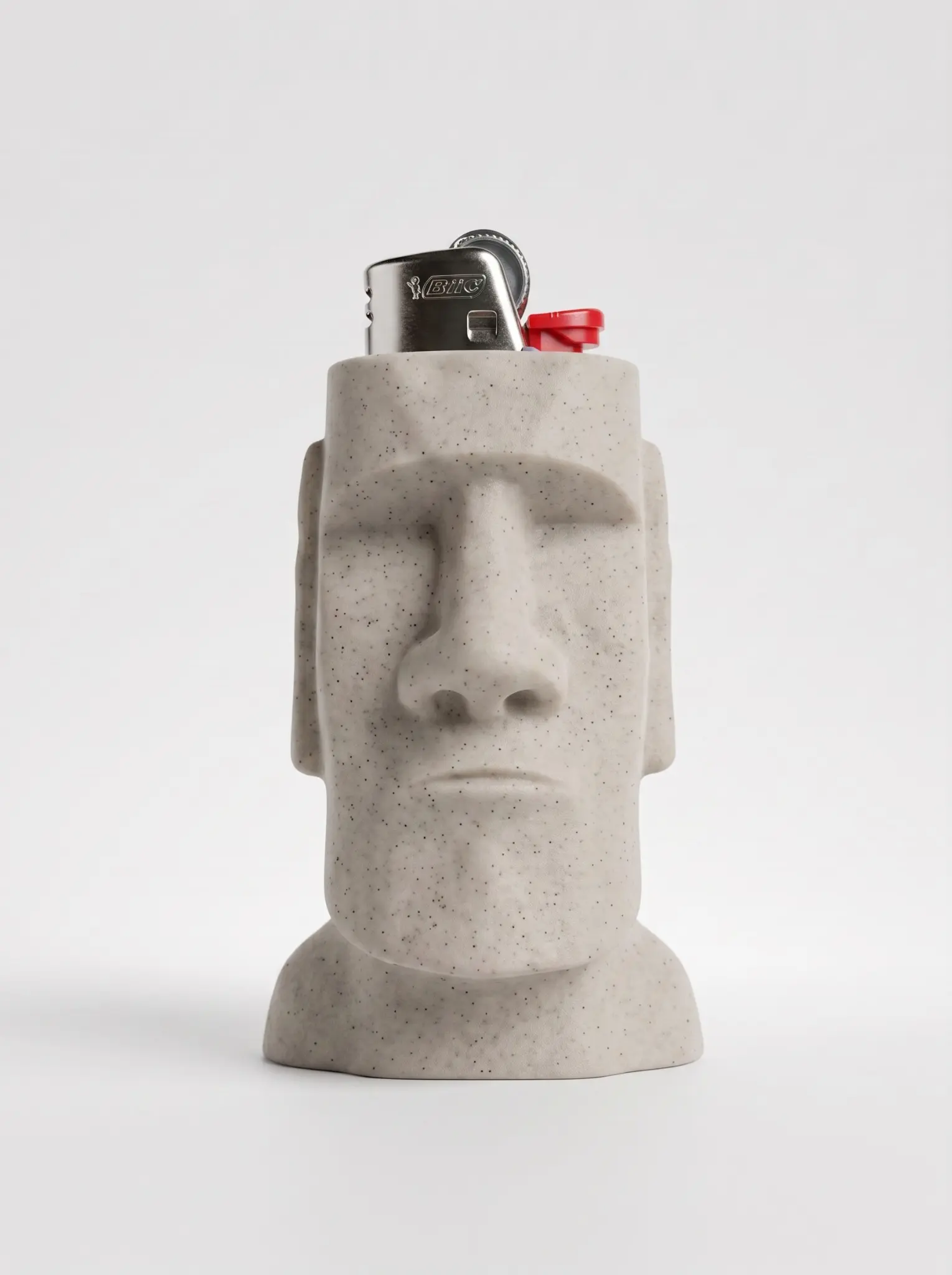 Stone-effect Moai head lighter sleeve with a speckled off-white finish