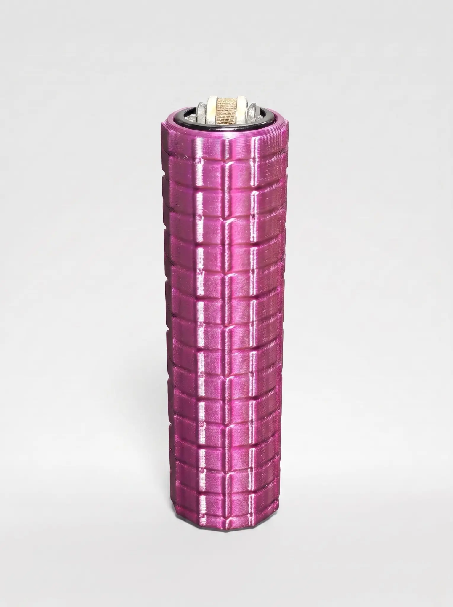Metallic-magenta Square Grip lighter sleeve with a raised geometric block texture
